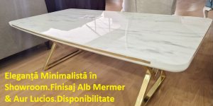 Măsuță de cafea ALYA ELITE cu picioare finisaj Auriu Lucios și blat MDF lăcuit model elegant alb mermer, fotografiată în showroom-ul Ferremo Otopeni.